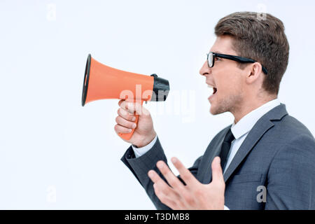 close up. angry businessman shouting into megaphone Stock Photo