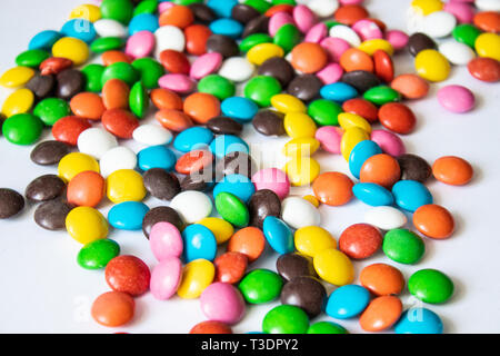 Round, multi-colored candies. Candy closeup on a white background. A pile of multicolored candies Stock Photo