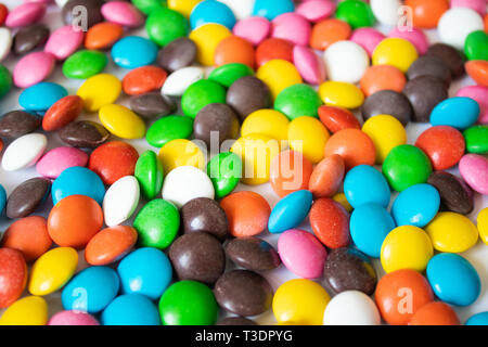 Round, multi-colored, chocolates. Close-up. A pile of multicolored candies Stock Photo