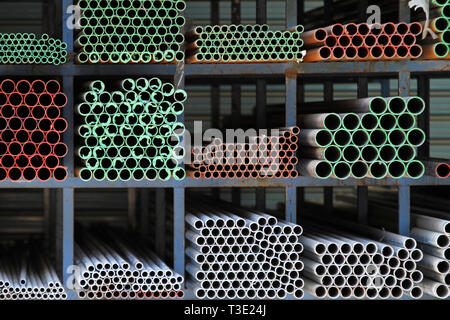 Ductile iron pipes at shelf in warehouse Stock Photo