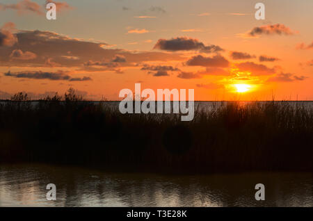 The sun sets over Heron Bay at Cedar Point, Sept. 7, 2012, in Coden, Alabama. Stock Photo