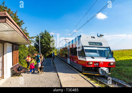 High Tatras, Slovakia - September 19, 2018: Tatra Electric Railways (TEZ-TER) train (also known as 'Tatra tram') arrives to Pod Lesom station in High  Stock Photo