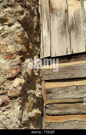 Wood, Mortar, and Stone Exterior of an American Pioneer Log Cabin Stock Photo