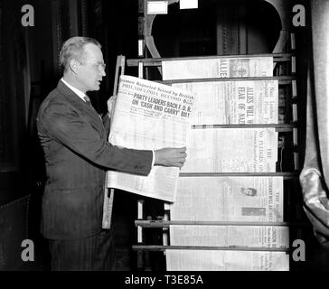 Man displaying front page of Philadelphia Record newspaper from September 21, 1939 Stock Photo