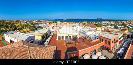 Panoramic aerial view of Corralejo town on Fuerteventura island, Canary Islands, Spain. Atlantic ocean, island of Lobos and Lanzarote Island on the ba Stock Photo