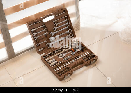 Suitcase full of various tools. adjustable wrenchs, screwdrivers Stock Photo