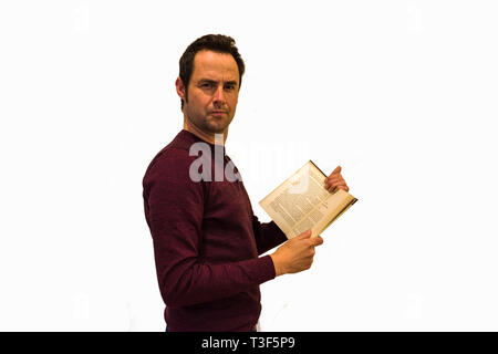 Man reading a book on white background Stock Photo