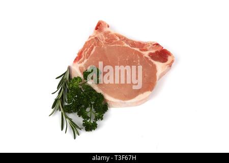 Fresh raw pork steak - pork loin chops with spices isolated on white background Stock Photo