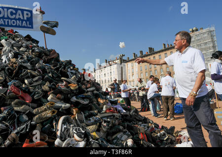 Pyamid of Shoes, Handicap International Anti-mines Day, Lyon, France Stock Photo