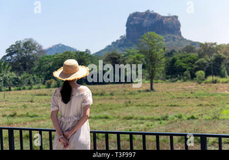 Woman enjoying Sigiriya rock view in Sri Lanka Stock Photo