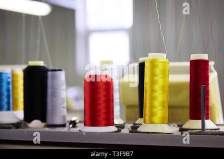 Automatic Embroidery Machines in process on the factory. 9 Needle Compact Embroidery Machine. Stock Photo