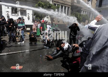 Algiers, Algeria. 09th Apr, 2019. Algerian security forces use water canons to disperse protesting students during an anti-government demonstraion. The Algerian parliament declared the vacancy of the president's post and named speaker Abdelkader Bensalah to lead Algeria for a transitional period of 90 days untill the election of the successor of the resigned president Abdelaziz Bouteflika. Credit: Farouk Batiche/dpa/Alamy Live News Stock Photo