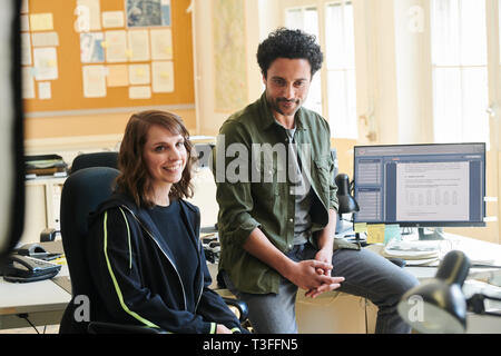 Potsdam, Germany. 09th Apr, 2019. Actors Caroline Erikson and Omar El-Saeidi sit at their desks during the shooting of the second season of the ZDF series 'Soko Potsdam' on set. Credit: Annette Riedl/dpa-Zentralbild/ZB/dpa/Alamy Live News Stock Photo