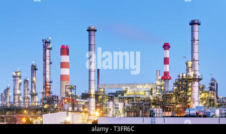 oil refinery industry plant along twilight morning Stock Photo