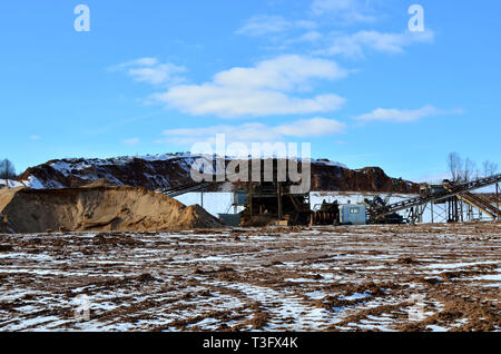 Mining plant in an open sand pit for the production of crushed stone, sand and gravel for use in industry and construction. Stock Photo