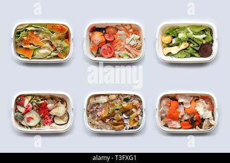Six container with frozen food for compost isolated on white background Stock Photo