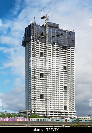 Manila, Philippines - January 17, 2017: Torre de Manila building while under construction, controversial due to its proximity to the Rizal Monument Stock Photo