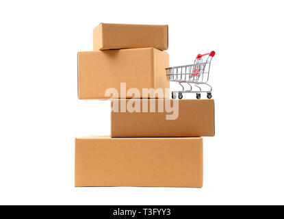 red shopping cart on brown parcels box Stock Photo