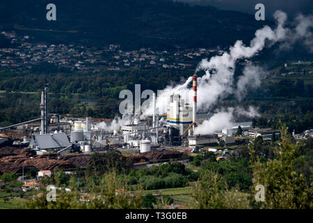 Aerial view of a factory polluting the air Stock Photo