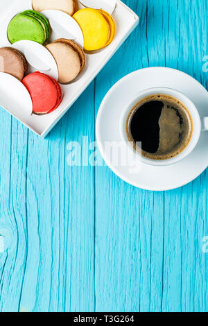 Multicolored macaroons with black coffee Stock Photo