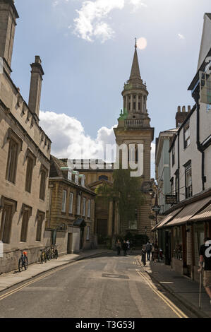 Lincoln College on left and small shops on right in Turf Street  and All Saints Church and spire on the corner of Turf Street and the High Street, Oxf Stock Photo