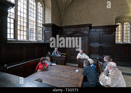 Visitors on a guided tour inside the Chancellor's Court at the Bodleian Library in Oxford, Britain. Stock Photo