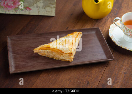 puff with twizzers with wood background Stock Photo