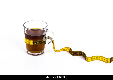 Slimming tea, cup with tea with lemon and measuring tape isolated on white background Stock Photo