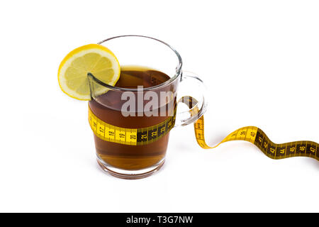 Slimming tea, cup with tea with lemon and measuring tape isolated on white background Stock Photo