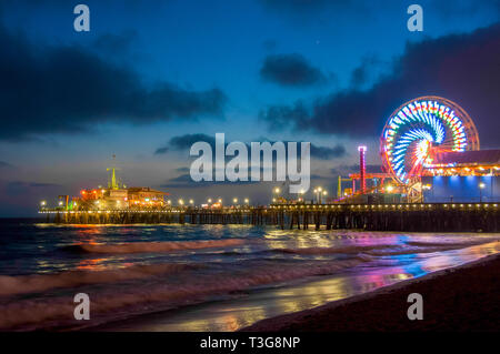 Amusement park on the pier in Santa Monica at night, Los Angeles, California, USA Stock Photo