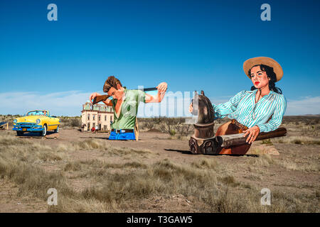 Giant Marfa, outdoor roadside mural, showing Liz Taylor, James Dean and Rock Hudson in scenes from Giant movie, near Marfa, Texas, USA Stock Photo