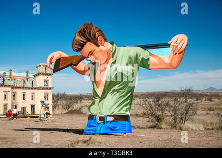 Giant Marfa, outdoor roadside mural, showing James Dean in scene from Giant movie, created by John Cerney in 2018, near Marfa, Texas, USA Stock Photo