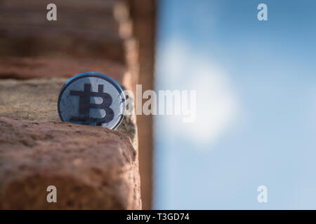 Made from black plastic custom bit coin in nature Stock Photo