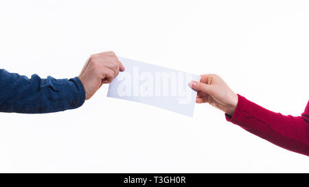 Transfer of correspondence between people.Man hand passes a white envelope to a costumer. Safe Mail delivery concept. Stock Photo