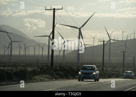 Large windmills on a wind farm in the California desert near Palm Springs generate clean alternative energy. Stock Photo