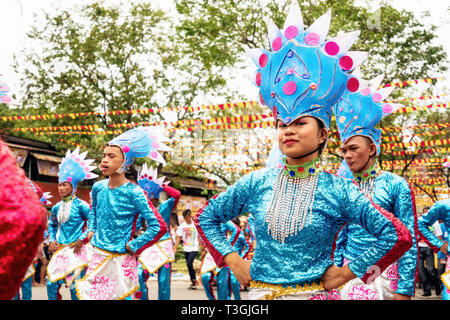 Cebu City , The Philippines - January 20, 2019: Street dancers in vivid colorful costumes participate in the parade at the Sinulog Festival.