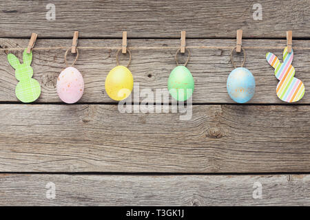 Colourful eggs and raper rabbits on rope Stock Photo