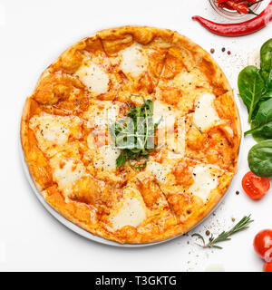 Delicious cheesy italian pizza on white table Stock Photo