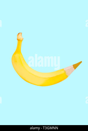 Natural drawing. An alternative yellow pencil as a banana against blue background. Negative space. Modern design. Contemporary art collage. Concept of healthy food, painting or arts, creating. Stock Photo