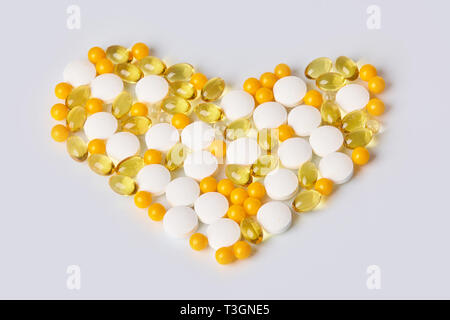 Heart made of different medicaments.  Isolated on white background. Stock Photo