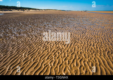 Ripples in the sand caused by the tidal movement of the sea on Holkham bay beach, North Norfolk coast, East Anglia, England, UK. Stock Photo