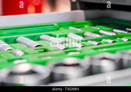 set of wrenches in a plastic stand in a drawer of a nightstand in a car repair shop Stock Photo