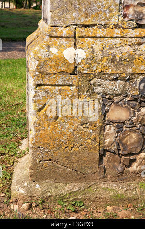A bench mark at the base of the Church tower in Strumpshaw, Norfolk, England, United Kingdom, Europe. Stock Photo
