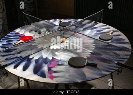 Table Tennis table with four (4) players Stock Photo