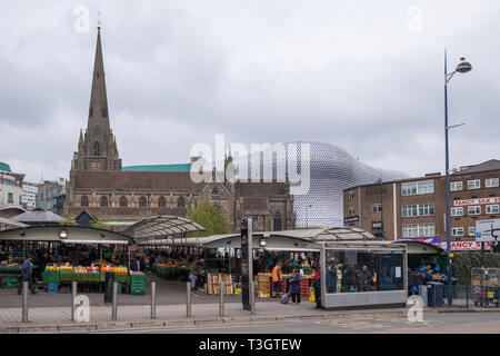 Birmingham outdoor market with the Selfridges building and St Martins Church in the background Stock Photo