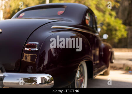 Izmir, Turkey - September 23, 2018: Back view of a Dark Red black colored 1948 Plymouth Deluxe. Stock Photo