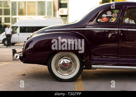 Izmir, Turkey - September 23, 2018: Back view of a Dark Red black colored 1948 Plymouth Deluxe. Stock Photo