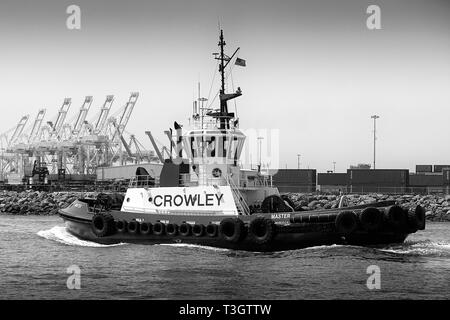 Black And White Photo Of The Crowley Maritime Tractor Tug, MASTER, Underway In The Port Of Long Beach, California, USA. Stock Photo