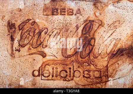 Vintage rusted Coca-Cola sign on wall in Spain Stock Photo