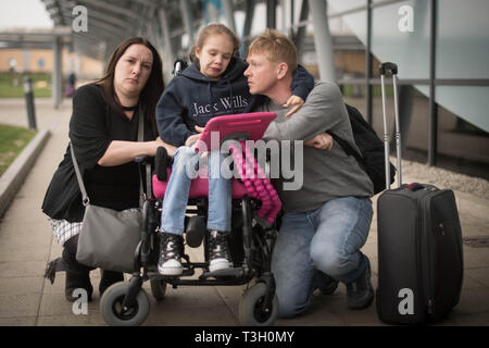 Emma Appleby (left), Lee Moore and their daughter Teagan who has severe epilepsy and was prescribed a cannabis-based medicine but has not been able to access it on the NHS, at London Southend Airport, Essex, after having the medicine they purchased in Amsterdam confiscated by customs officers. Stock Photo